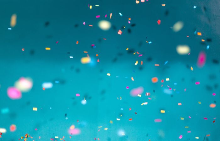 turquoise background with confetti